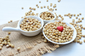 Raw soybeans (Glycine max) displayed in containers