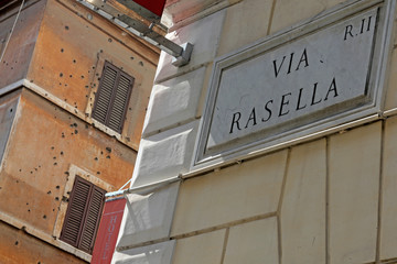 Fototapeta premium On Via Rasella in Rome, Italy, bullet holes remain in the walls of a building from the March 23,1944 attack by the Italian Resistance against German military police that killed 32 men.