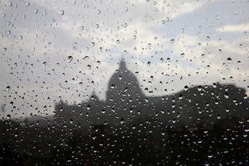 St. Peter’s Basilica in Vatican City seen through a rainy window.