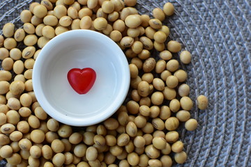 Obraz na płótnie Canvas Raw soybeans (Glycine max) displayed in containers