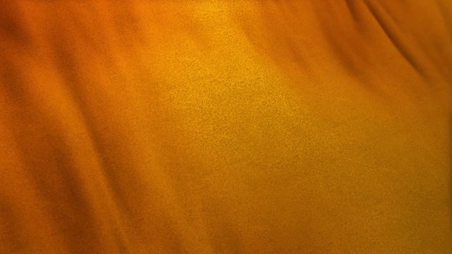 orange flag cloth in full frame with selective focus. Seamlessly looping 3D animation of dark orange and golden colored garment with clean natural linen texture for background banner or wallpaper use.