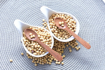 Fototapeta na wymiar Raw soybeans (Glycine max) displayed in containers