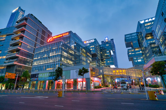 SHENZHEN, CHINA - APRIL 15, 2019: street level view of buildings in Shenzhen at dusk.