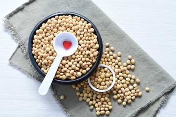 Raw soybeans (Glycine max) displayed in containers