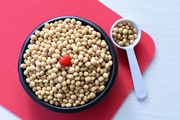 Raw soybeans (Glycine max) displayed in containers