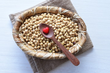 Raw soybeans (Glycine max) displayed in containers