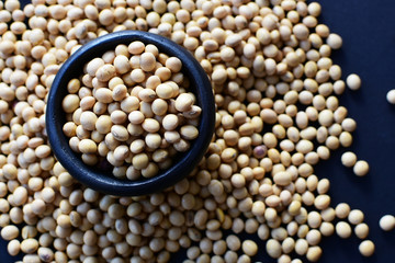 Raw soybeans (Glycine max) displayed in containers