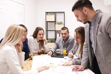 group of successful young architects and businessmen in modern workplace, having a creative meeting.