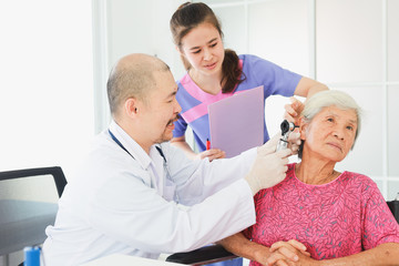 Fototapeta premium Asian Old Patient woman Talking with Medical Doctor in clinic office hospital