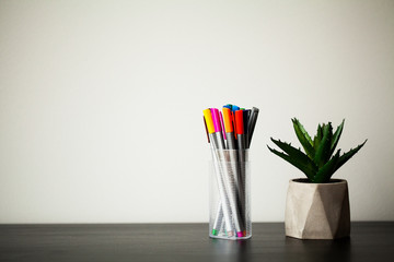 Interior items stand on a table in a bright room