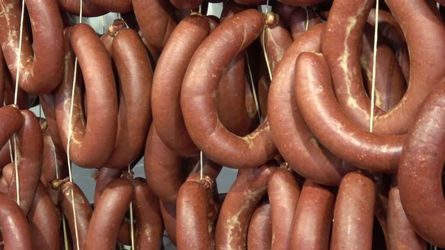 Fethiye, Turkey - 4th of March, 2020:  4K Panning rings of fresh made Turkish sucuk sujuk sausages