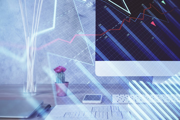Forex market chart hologram and personal computer background. Multi exposure. Concept of investment.