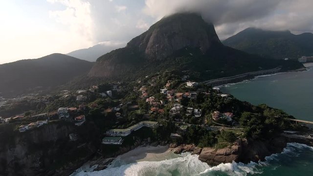 Rio De Janeiro aerial view! Helicopter view of the Brazilian capital city. Town, streets, and buildings. Panoramic view of Brazil with famous beach background. Aerial cityscape.