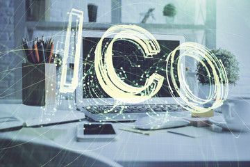 Multi exposure of blockchain and crypto economy theme hologram and table with computer background....