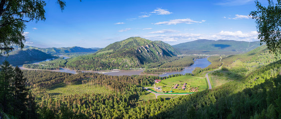 Tourism in Altai, Russia. View of the valley and the river from the mountain. Panoramic view.