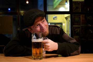 Guy with beer in the bar