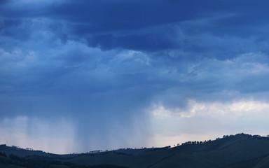 Thundercloud, it is raining. Weather phenomena, natural background.