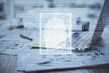 Computer on desktop in office with finger print drawing. Double exposure. Concept of business data...