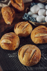 Wood table with breads and basket eggs