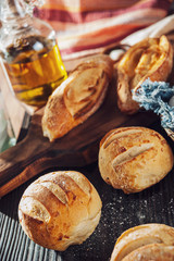 Obraz na płótnie Canvas Wood table with breads and vegetal oil