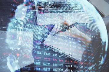 International business hud over woman's hands writing background. Concept of hard work. Double...