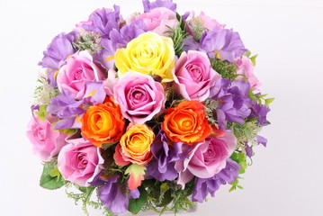 Colorful flower arrangement centerpiece in square glass vase