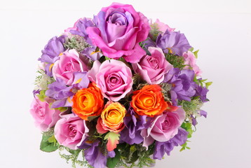 Colorful flower arrangement centerpiece in square glass vase