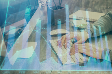 Double exposure of financial graph with man works in office on background. Concept of analysis.