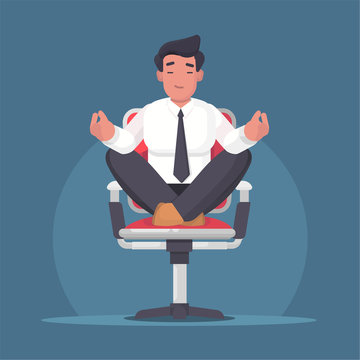 Businessman meditating and relaxing in office