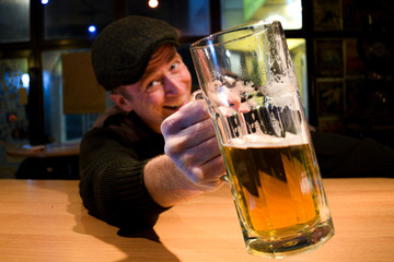 Guy with beer in the bar