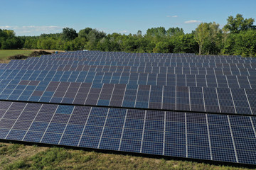 Power plant using renewable solar energy with sun. Solar panels in the field