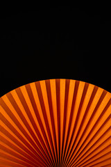 abstract orange background hand fan