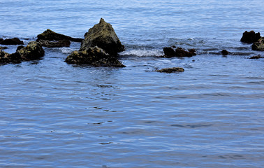 Landscape of large and small rocks in the sea.