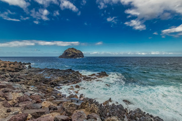 Fototapeta na wymiar A rocky beach with little waves at Tenerife island - Canary Spain