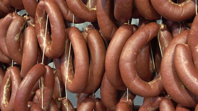 Fethiye, Turkey - 4th of March, 2020:  4K Zoom out rings of fresh made Turkish sucuk sujuk sausages for sale, close up