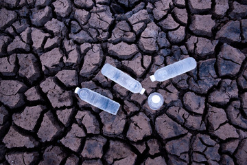 Plastic water bottles, water bottles on the ground cracked, drought in Asia