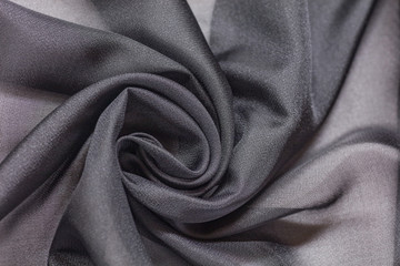 Shiny grey cloth background dark curly background