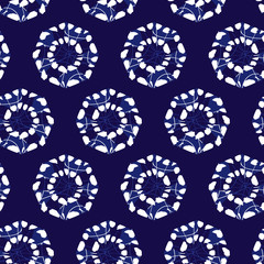 Vector blue shibori monochrome octagon wheels seamless pattern. Suitable for textile, gift wrap and wallpaper.