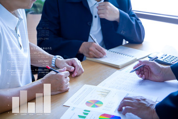 Business men in a meeting discuss and review financeial statements and reports on business...
