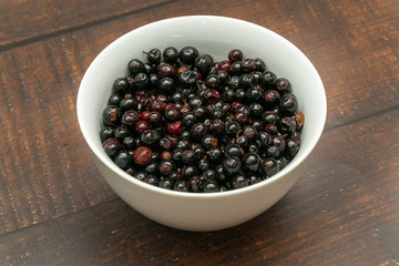 Dark blue small grapes or Vaccinium meridionale, agraz, close up.