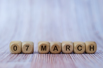 Date March 7, wooden cubes. Days of the month