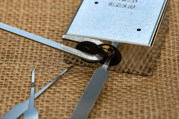 lock picking tools used to open a pad lock
