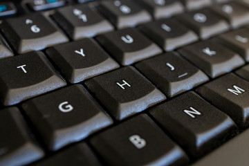macro photo of keys on a computer keyboard