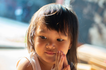 The face of an innocent looking Asian girl