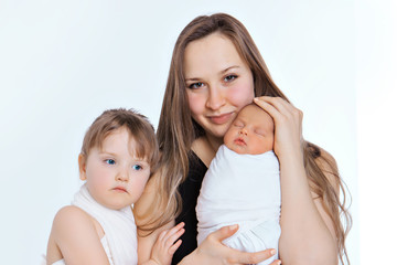 concept of healthy lifestyle, the protection of children, shopping - baby in the arms of the mother. Woman holding a child. Tree girls. Isolated on white background. Copy space. 8 march, mother's day
