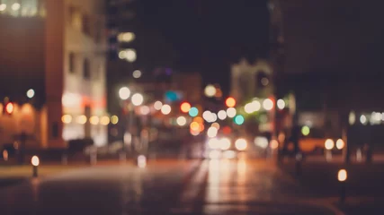 Foto op Canvas Abstract blur urban city street road with people walking and lighting bokeh for background. © bunditinay