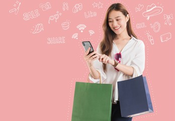 Asian beautiful women blogger are using the smartphone shopping online with shopping bag and doodle graphic background.Concept of online shopping business.