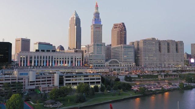 Aerial flying over downtown Cleveland city skyline at sunset, Ohio, USA