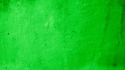 Rough concrete wall texture, bright green, vintage rustic grunge background