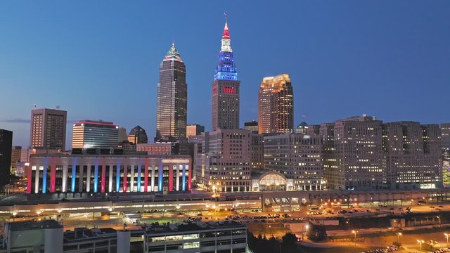 Aerial flying over downtown Cleveland city skyline at sunset, Ohio, USA